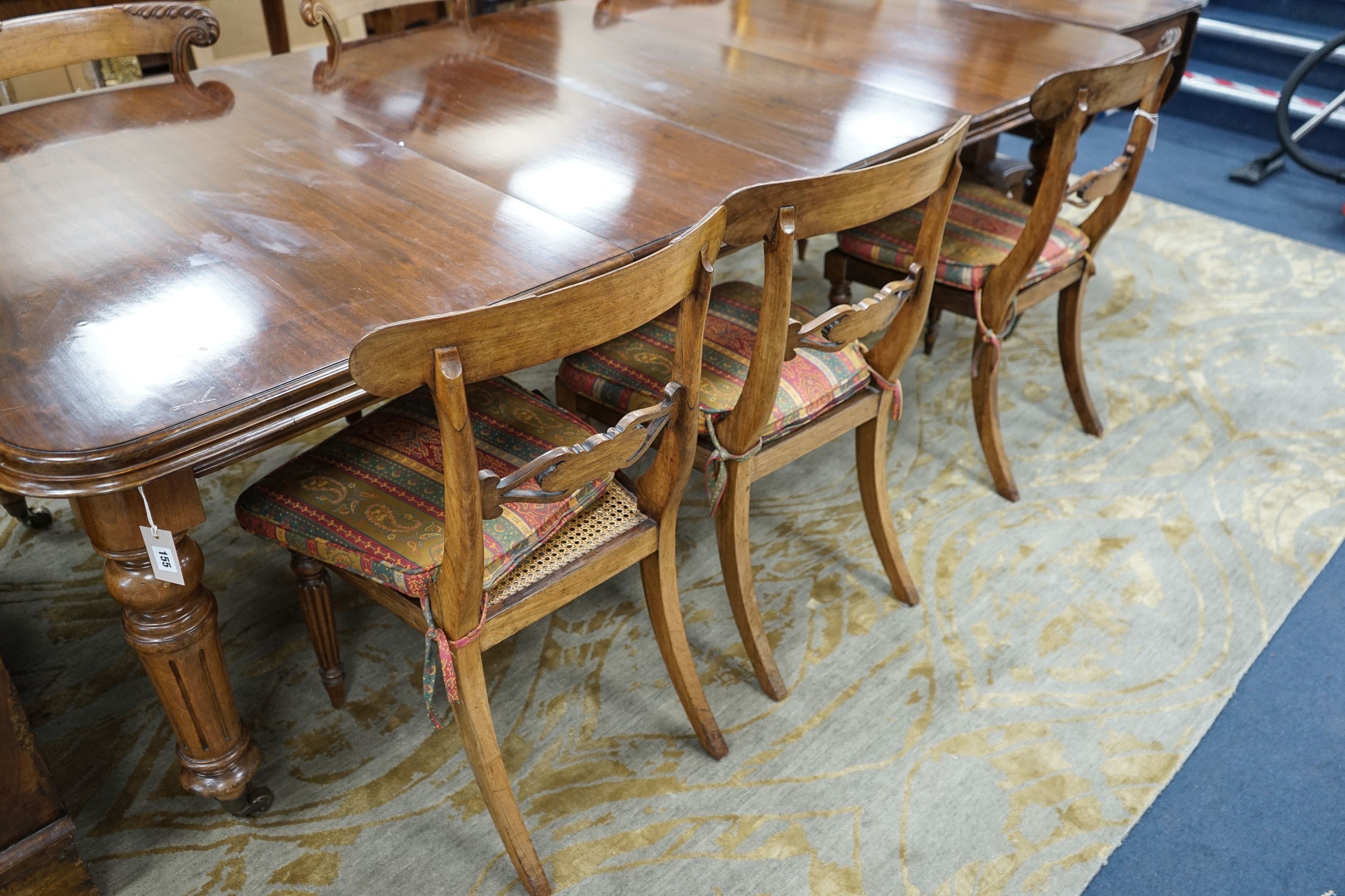 A set of six Regency faded rosewood dining chairs with squab cane seats